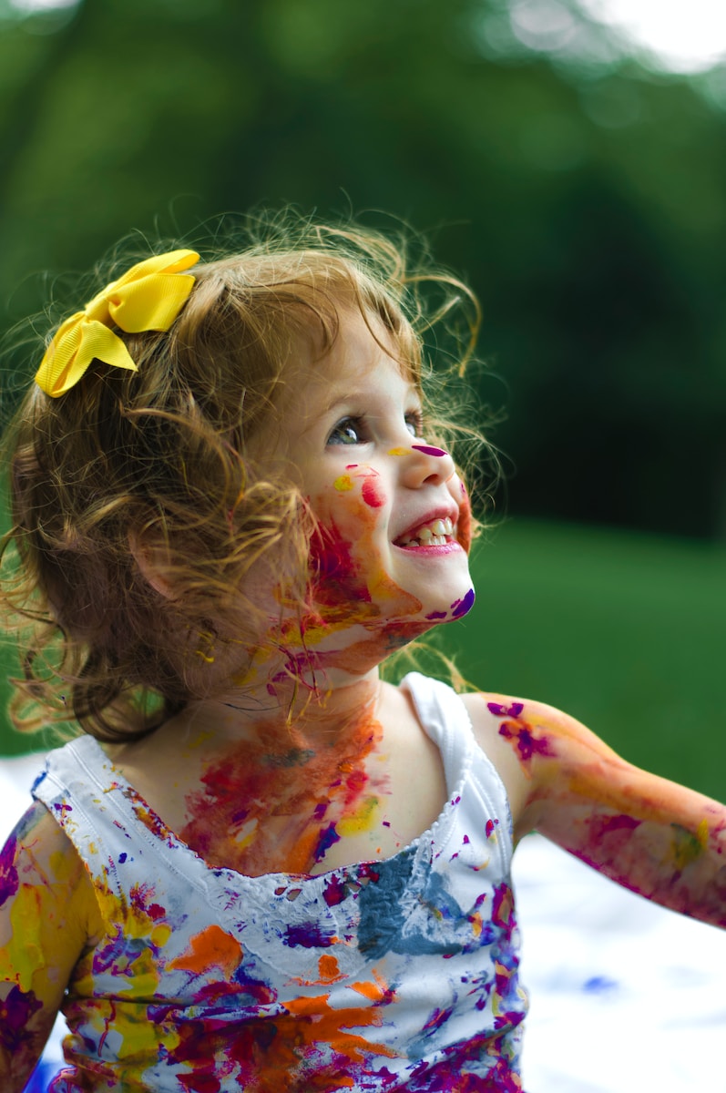 girl with paint on body to teach emotional development to children